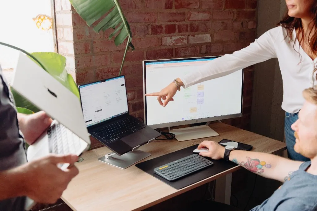 The Early team reviewing product work at a desk